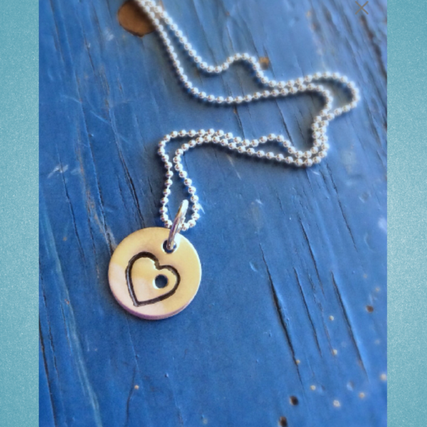 charmholeheartnecklae.jpg.